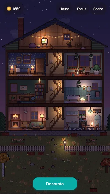 The finished house in the evening with lights glowing in every room.